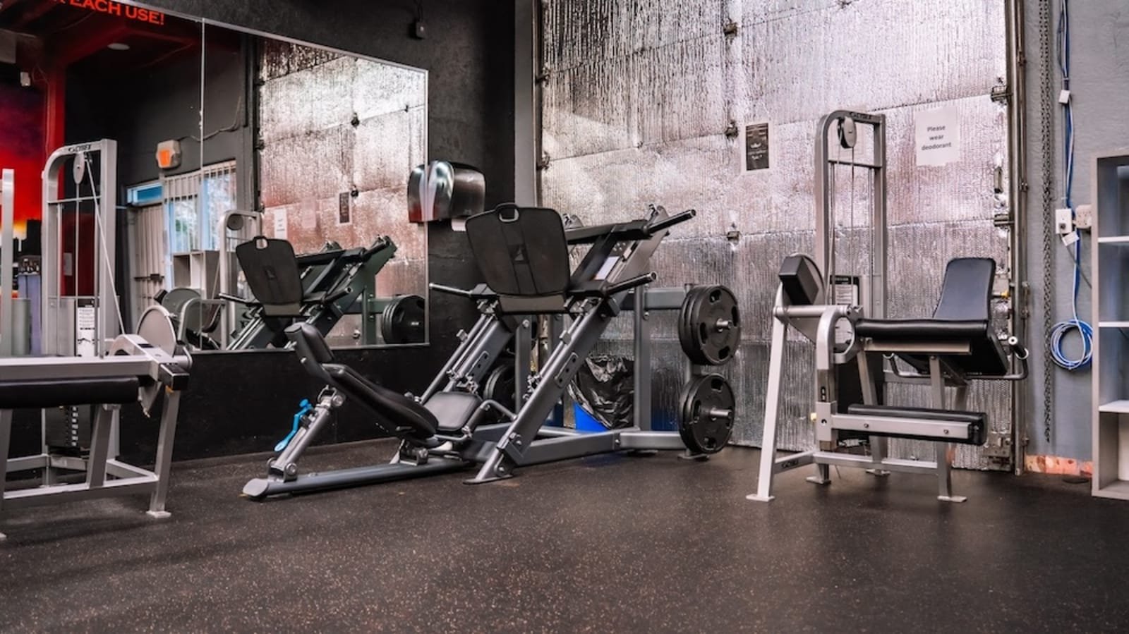 Plate-loaded machines on the main floor at Level Up Fitness Club